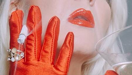 Queen Joan in red satin gloves sublimely smoking Winston Gold 100s while enjoying her champagne