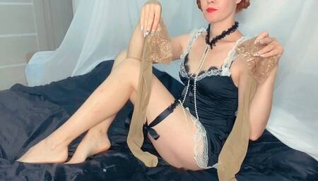 The maid is trying on nude-colored stockings