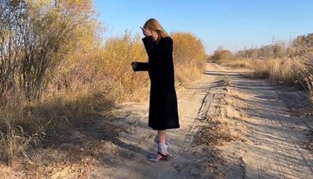 girl with tied legs in high heels tries to run away to hide, she falls, tries to jump, takes off her shoes and jumps barefoot