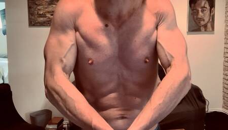 Devon flexing his muscles and punching his abs up close HD