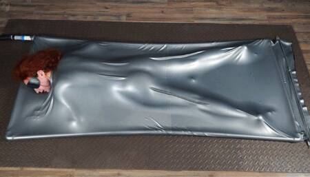 Orgasms butt up in a gray latex bed