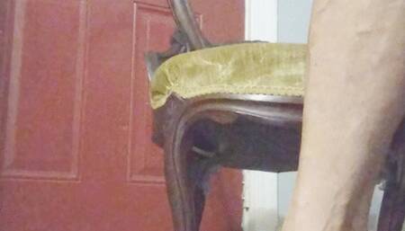 Tempest sitting in gold chair with witchy heels