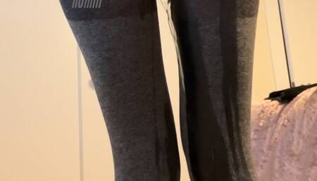 pissing in tight gray leggings
