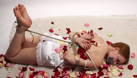 Tapegagged barefoot Irene in white lace nightie, hogtied with hemp rope, wiggles on the floor (HD WMV)