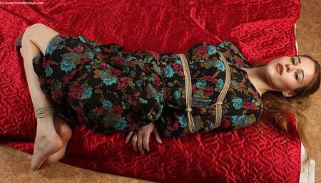 Anne: barefoot girl in flower dress, hogtied on the floor with hemp rope, wiggles and poses (HD MP4)