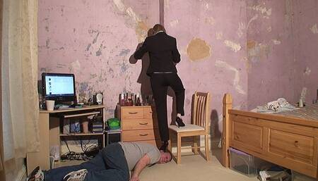 Danielle Smart Suit Head Trampling With A Foot On The Chair