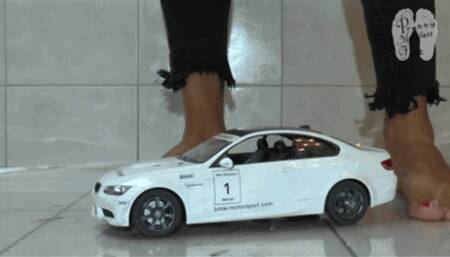 RC Car under naked feet and clear heels floor view