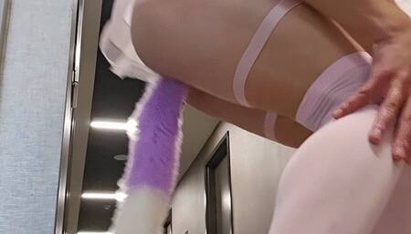 Pink cyber kitty playing in the public hallway and stairwell