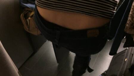 Trying on jeans in a store