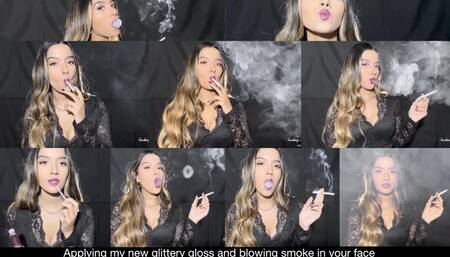 Applying my new glittery lipgloss, smoking 100s and blowing smoke in your face!