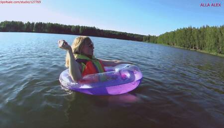 Alla swims in an inflatable ring on the lake!!!
