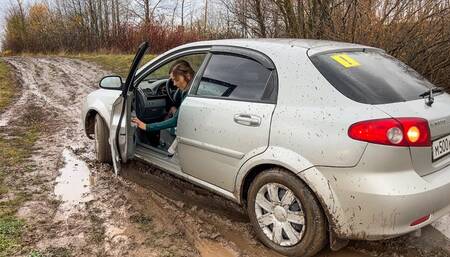 CAR STUCK Novice driver stuck in mud