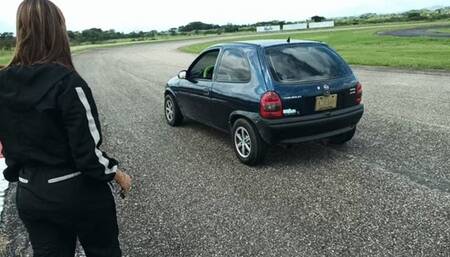 Miaisbeth cranking and starting her Chevy Corsa