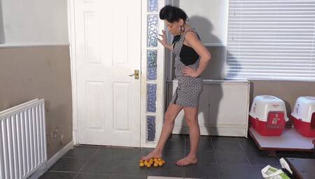 Katie Stepping On Oranges With Her Bare Feet (4K)