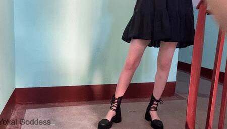 Trampling and soles licking in fashion sandals on the public stairs