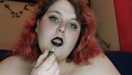 Covering your cock with black lipstick kisses