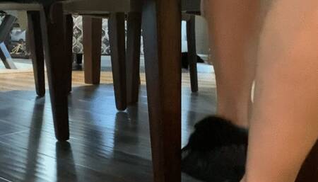 Feet under chair- removing Moccasins