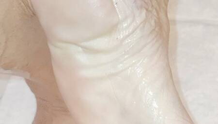 POV oiled legs and feet