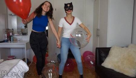 Saskia and Foxy team sit popping Ballon Ace
