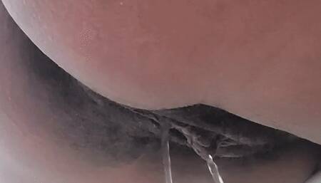 Long piss over the edge of the bathtub