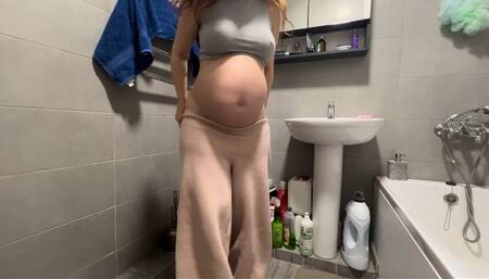 who is spying on a pregnant woman in the toilet?