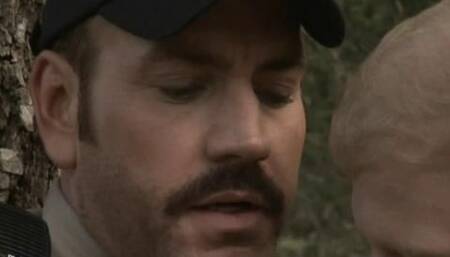 Tied to a Tree Face to Face With a Cop