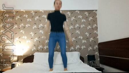 Jumping in the hotel's bed