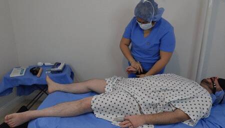 Doctor performs intense milking on her restrained patient