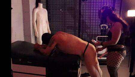 Scarlett Kage roughly pegs submissive slave kneel over a medical table in the dungeon SIDE view- pegging, rough, femdom, chastity, cbt, mask fetish, fishnets, bdsm, dungeon MP4