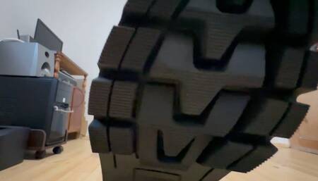 Huge army boots crush a plush toy