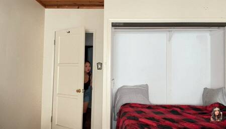 Clipping her fingernails