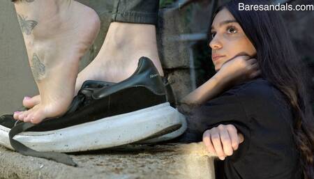 Taking off my black sneakers while standing outside - Alicia update13465 - 4K video