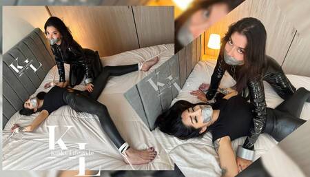 Mara TapeGagged in Spread Eagle - Simona in Black Catsuit Dominates her for a Gag Kiss