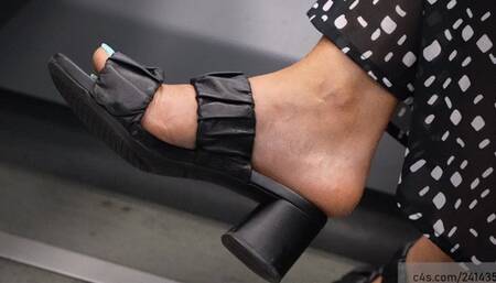 Foot fetish woman in open summer sandals, beauty heels and toes, perfect feet close-up