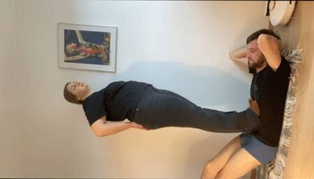 Heavy boots trampling through t-shirt - vertical