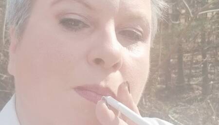 Mature Lady L outdoors smoking clip #1