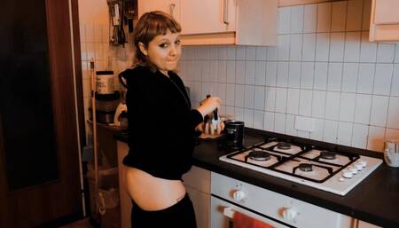 Lovely young wife makes hot coffee with buttrack!