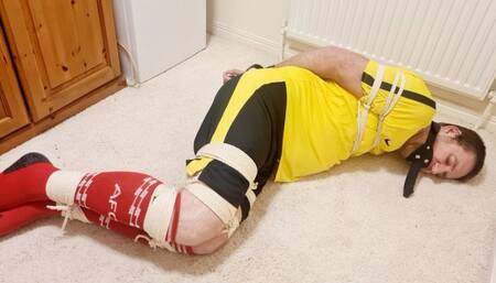 Miss M edging a tied up footballer with her wand