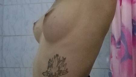 Carina sniffs her armpits