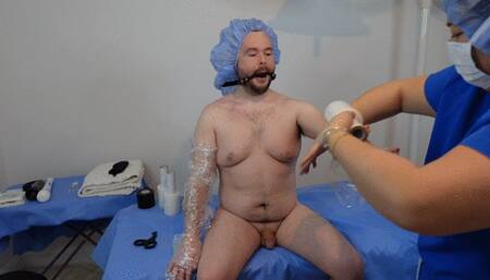 Doctor mummifies and milks her patient in bondage