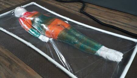Mummification with multicolored stretch wrap in a transparent vacuum bed with vibro and orgasms