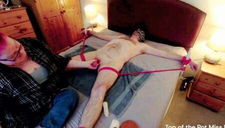 Miss M post orgasm torment on a spreadeagled sub on bed