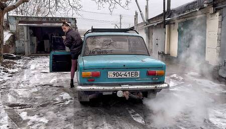 Nastya warms up an old car
