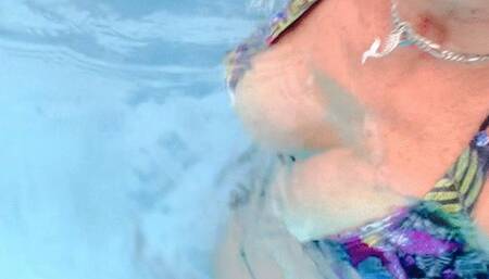 Tiny black flowered bikini in the Resort Pool extended version