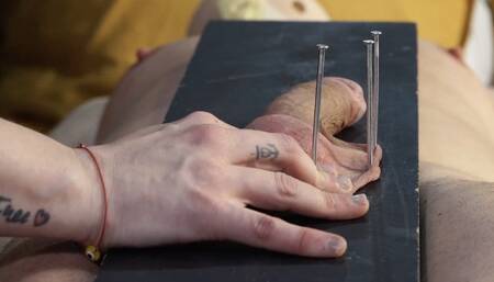 balls nait to a board and then a massager on top this bitch comes hard on cbt