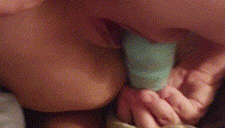 Fucking her with a butt plug from behind