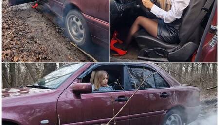 Lucy is lost and desperately trying to get out of the mud in an old Mercedes