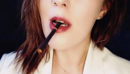 Inhaling elegance smoking an all black cigarette, exhaling dreams with every puff