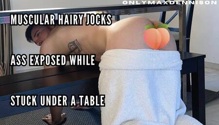 Muscular hairy jock Ass exposed while stuck under the table