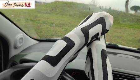 Lady S driving bored in boots and pantyhose